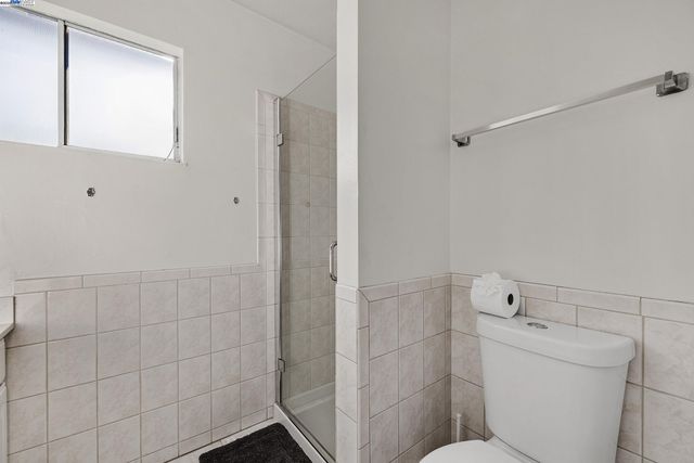 a bathroom with a toilet and a sink