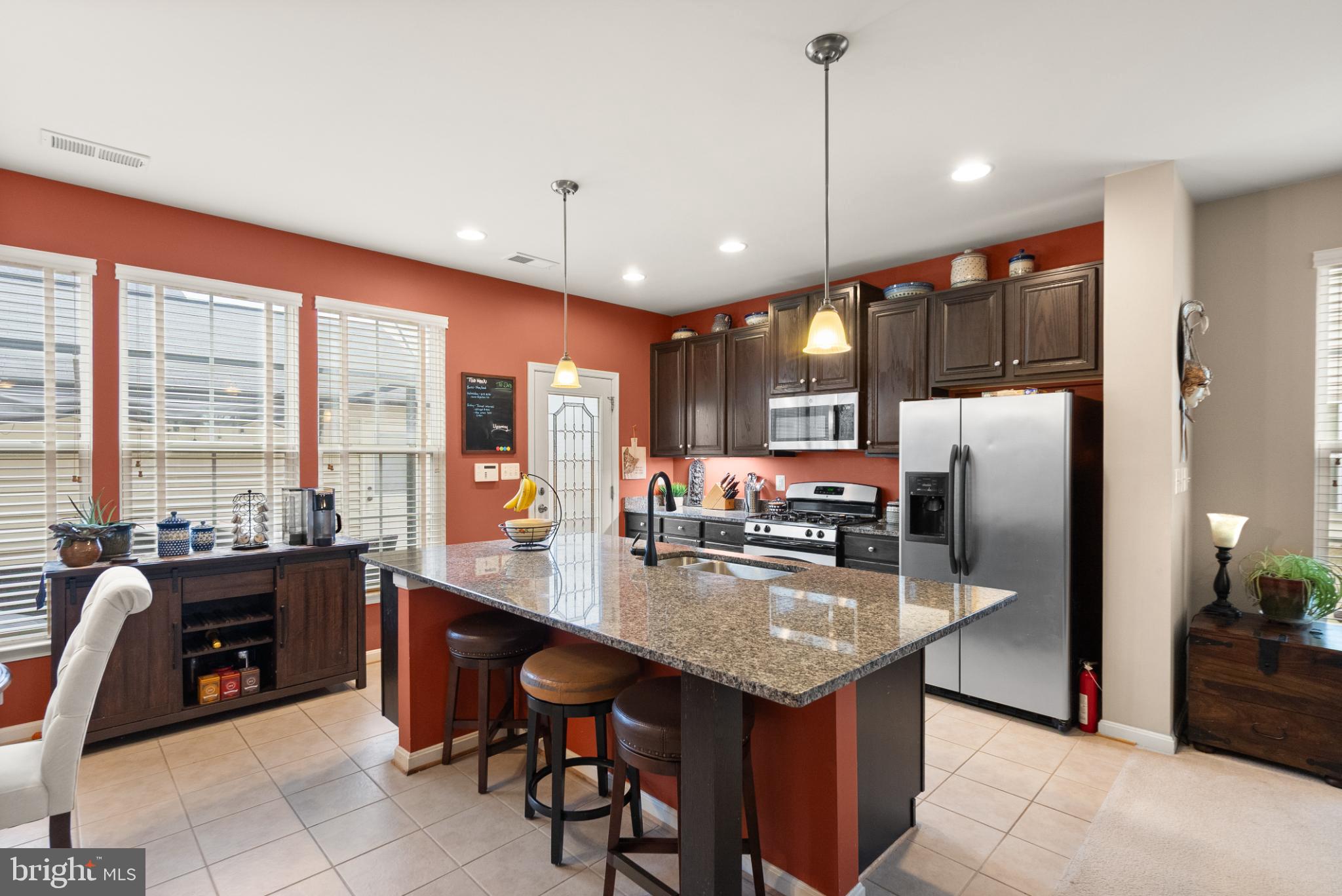 11968 Benton Lake Road Bristow, VA 20136 - Photo 13 of 52 Granite eat-in prep island with pendant lighting.