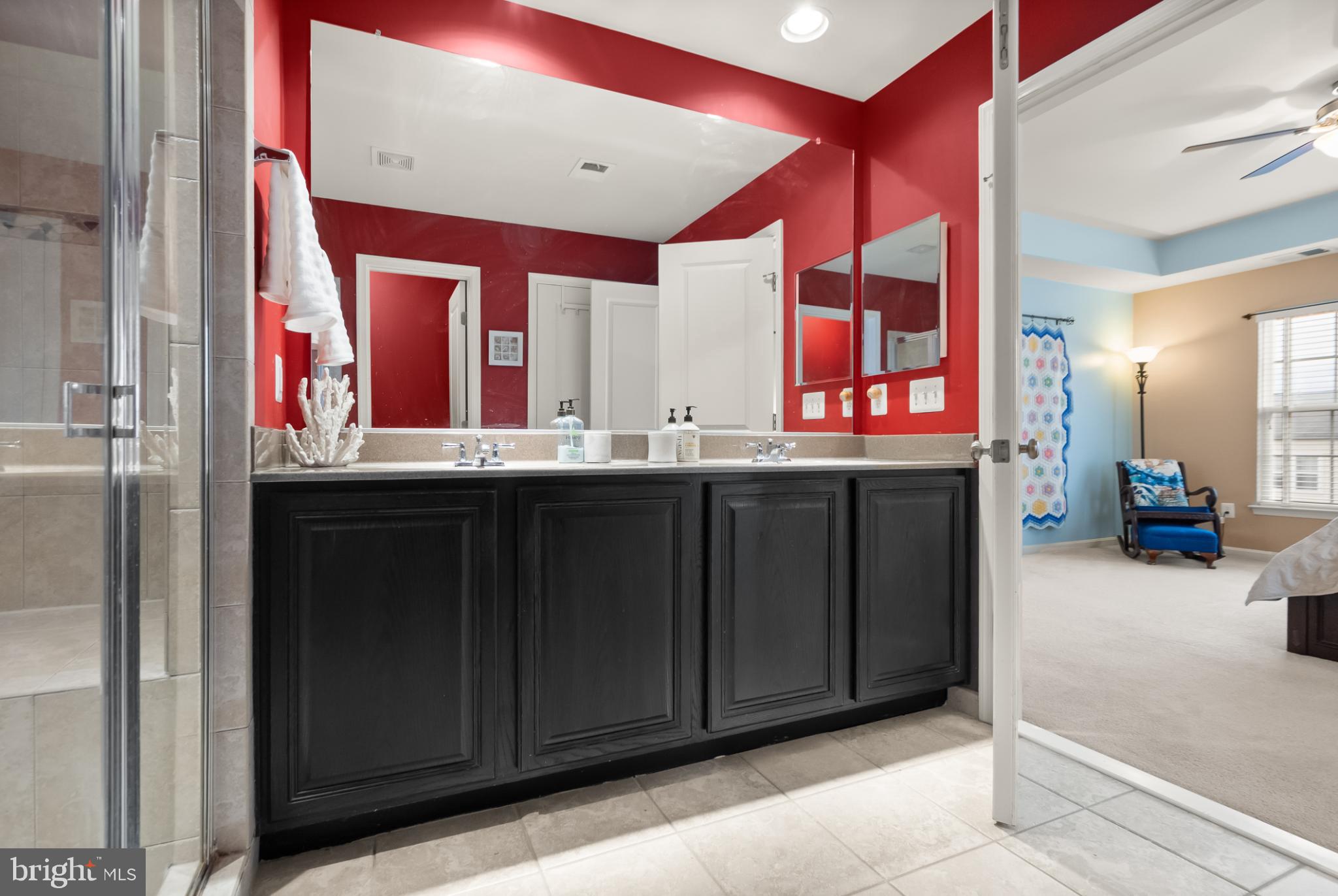 11968 Benton Lake Road Bristow, VA 20136 - Photo 38 of 52 Full width mirror, double sink & wood vanity.