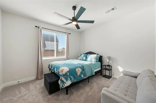 a big house with a big yard and large trees