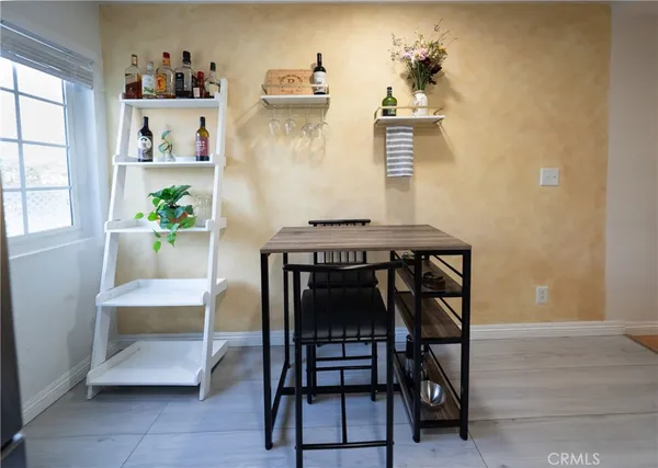 a dining room with furniture and window