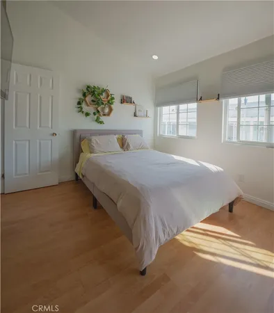 a bedroom with a bed and a view of bedroom