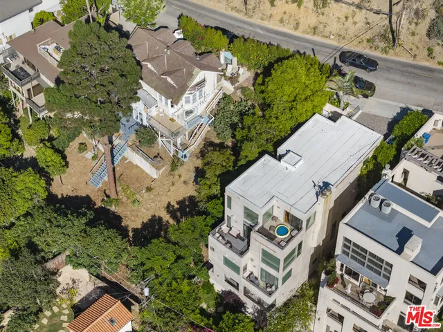 an aerial view of a house with a garden
