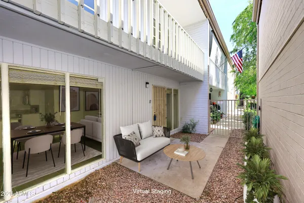 a view of balcony with furniture
