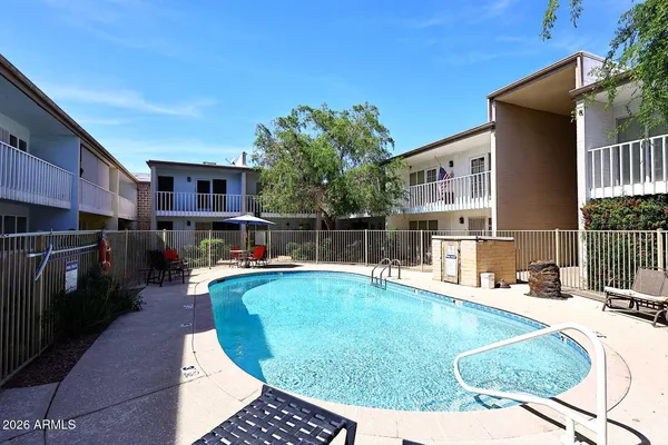a view of a swimming pool with a patio