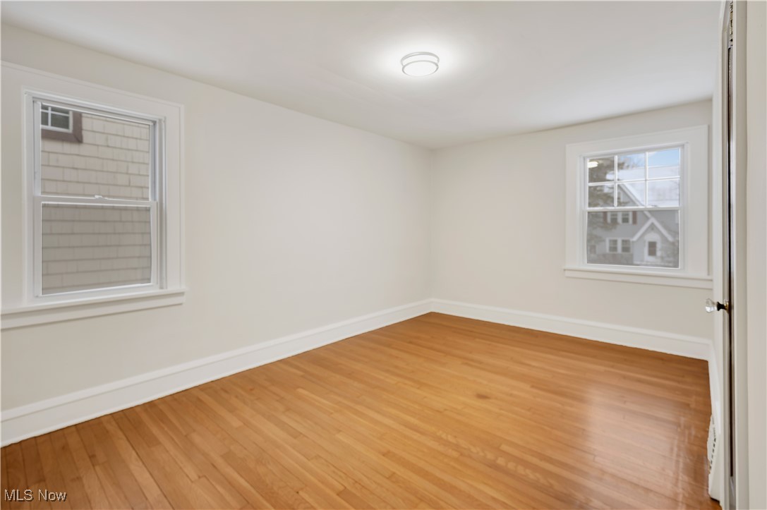 2016 Rossmoor Road Cleveland Heights, OH 44118 - Photo 34 of 46 Spare room with light wood-style flooring and baseboards