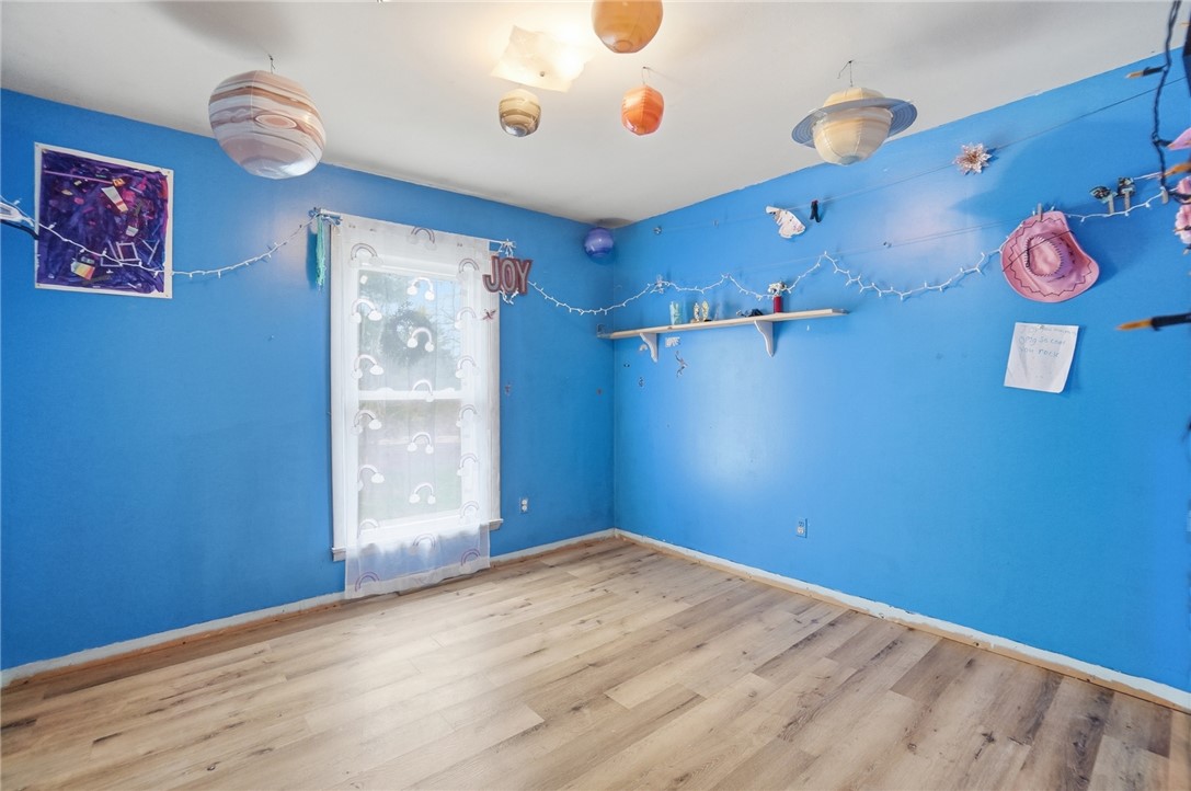 290 Ginghamsburg Road Tipp City, OH 45371 - Photo 25 of 49 This spacious room features ample natural light and durable flooring, offering a versatile living space.
