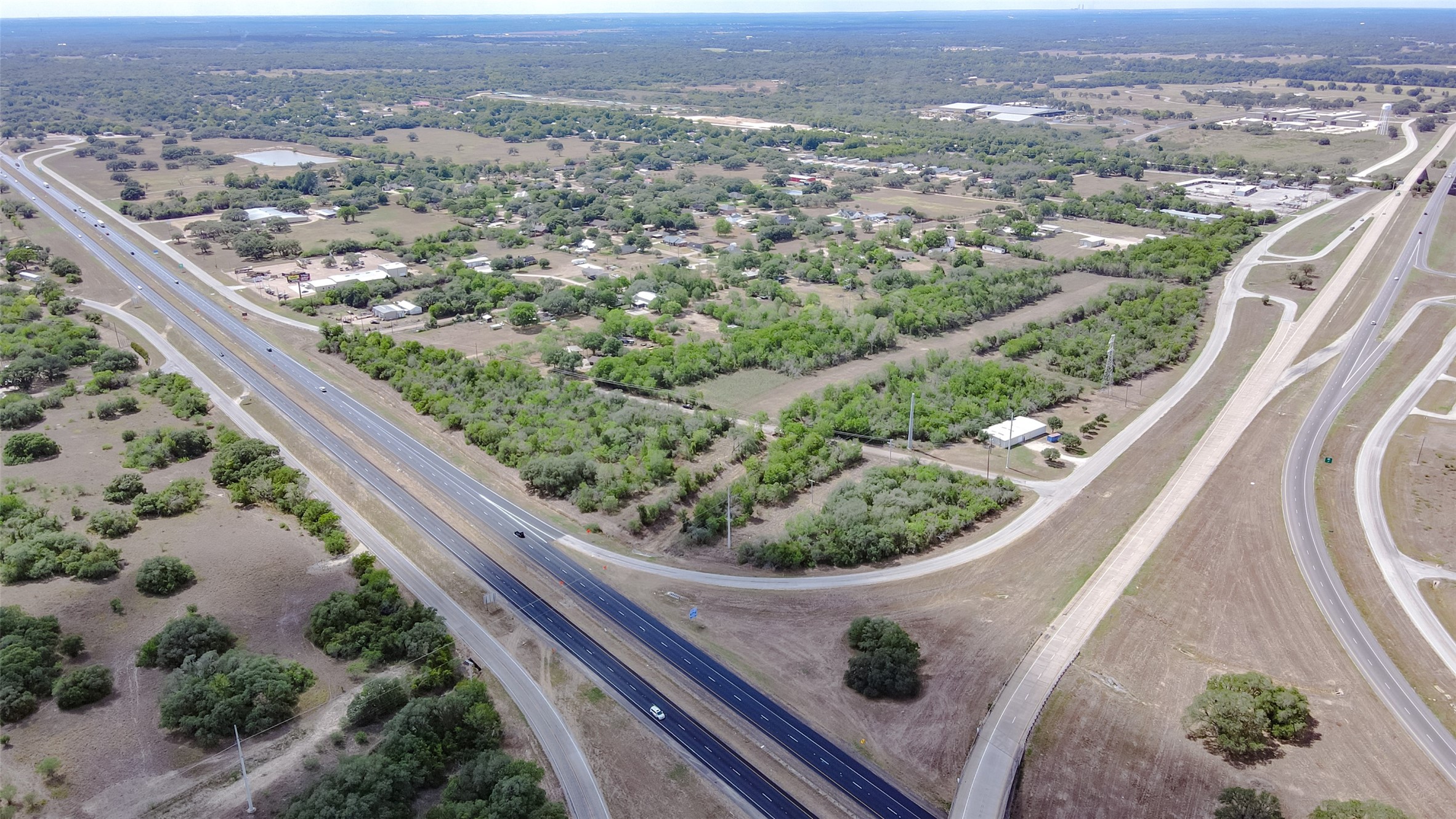 0 State Highway 71 Bypass Columbus, TX 78934 - Photo 2 of 11 an aerial view of a residential houses covered with trees