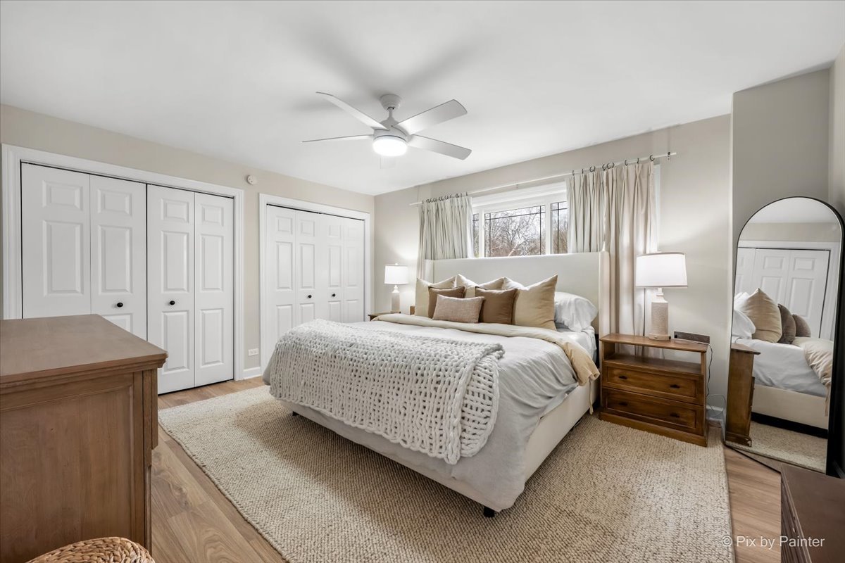 1908 Moore Avenue St. Charles, IL 60174 - Photo 18 of 45 a spacious bedroom with a bed and a chandelier