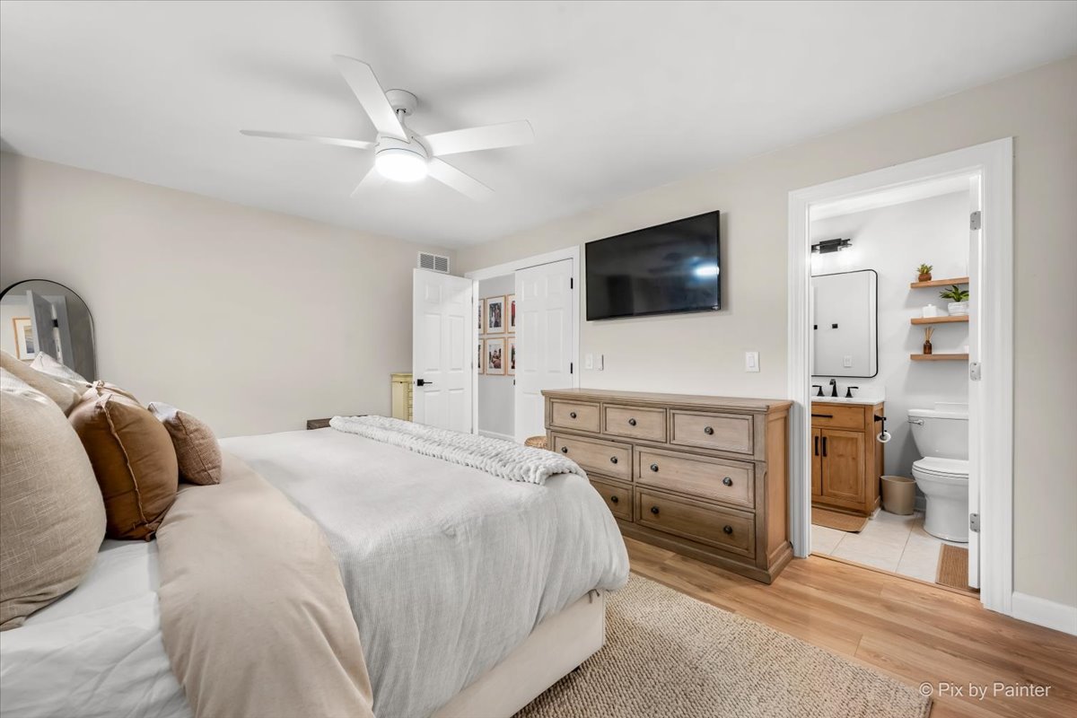 1908 Moore Avenue St. Charles, IL 60174 - Photo 20 of 45 a bedroom with a bed and a flat screen tv