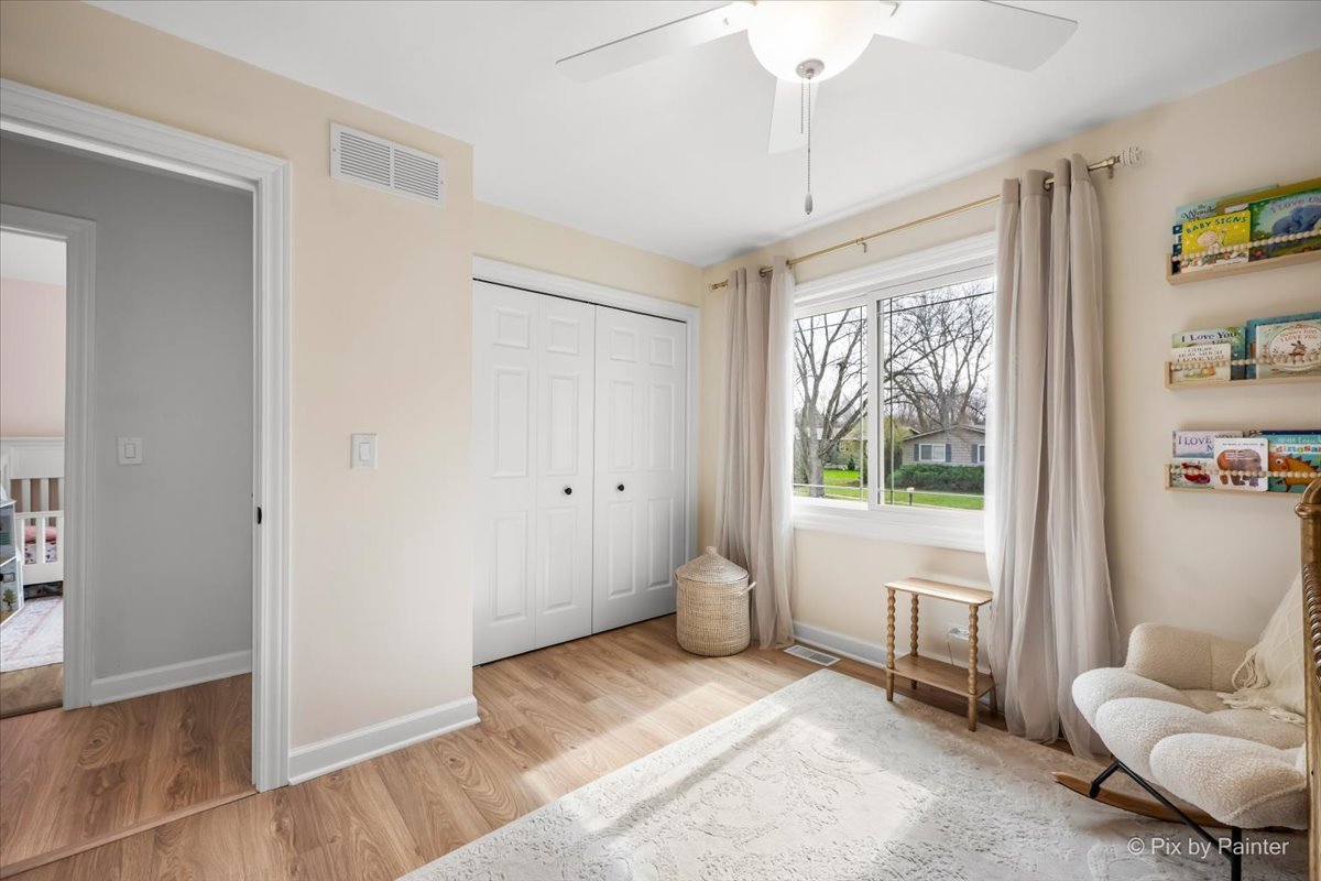 1908 Moore Avenue St. Charles, IL 60174 - Photo 24 of 45 a spacious bedroom with a bed and a window
