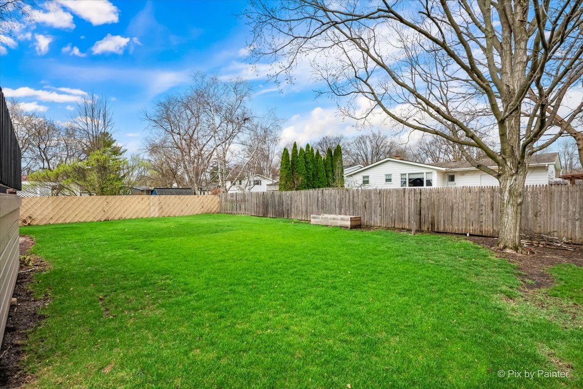 1908 Moore Avenue St. Charles, IL 60174 - Photo 44 of 45 a view of yard with green space and wooden fence