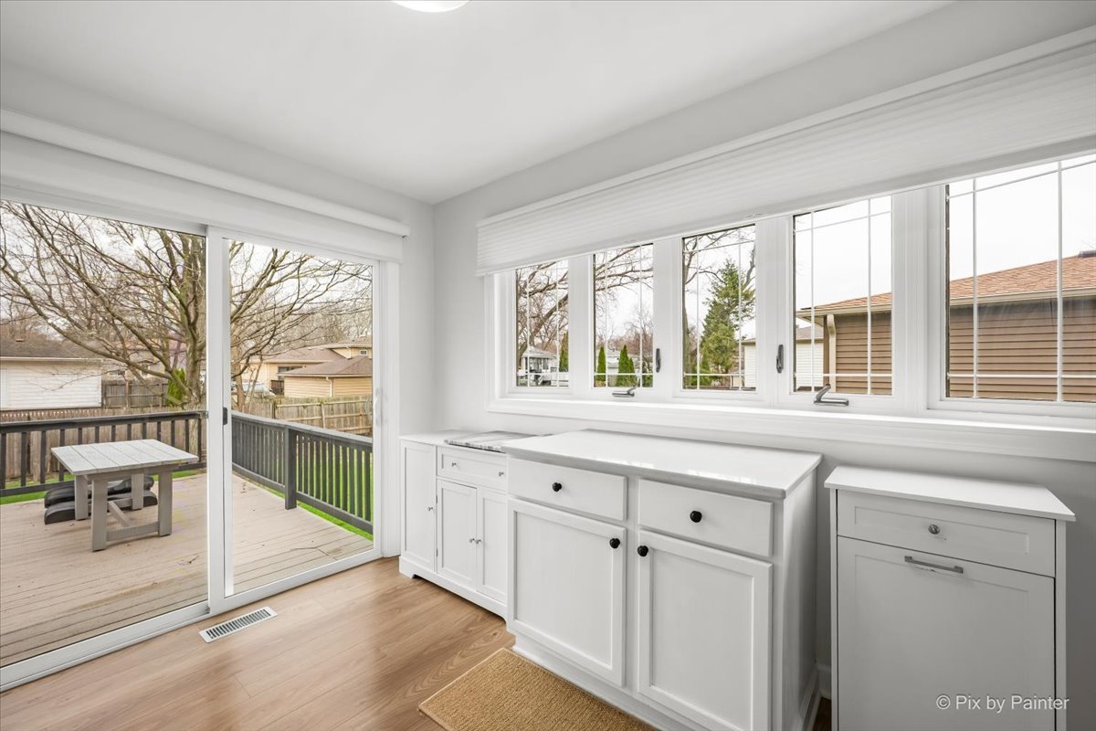 1908 Moore Avenue St. Charles, IL 60174 - Photo 10 of 45 a kitchen with granite countertop a stove and a large window