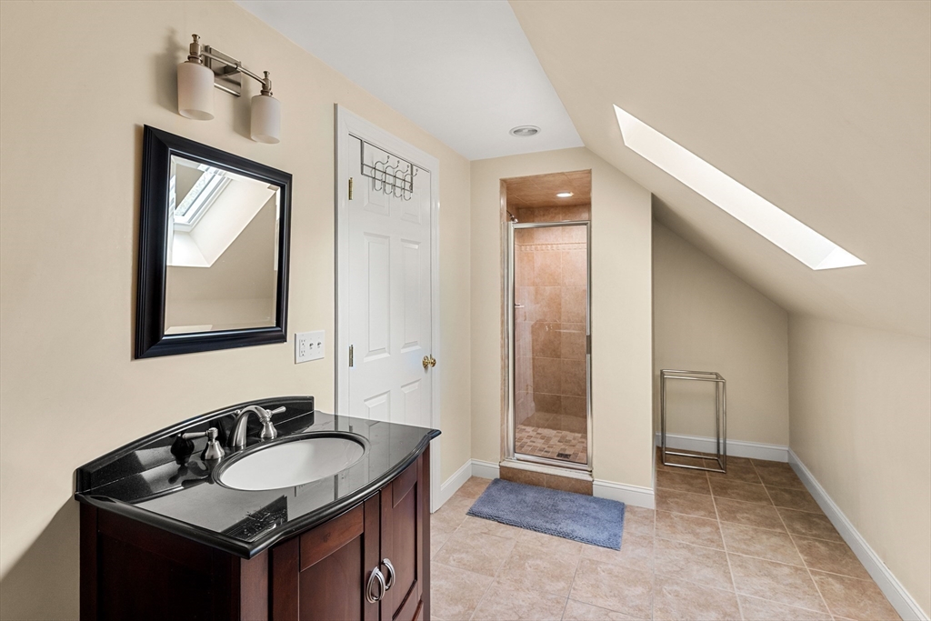 37 Old Planters Road Beverly, MA 01915 - Photo 35 of 42 a bathroom with a sink and a mirror