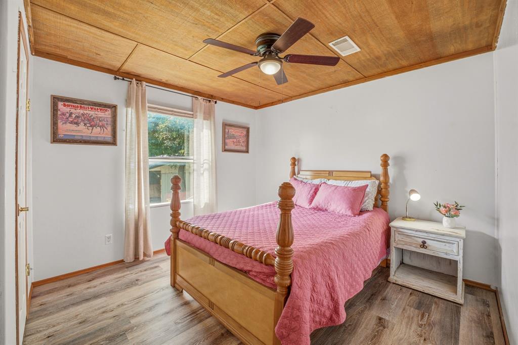 151 High Point Road Weatherford, TX 76088 - Photo 15 of 40 a bed room with a bed and a window