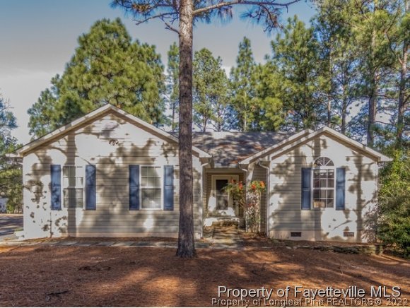 160 Old Hunt Road Pinehurst, NC 28374 - Photo 1 of 21 a front view of a house with a yard