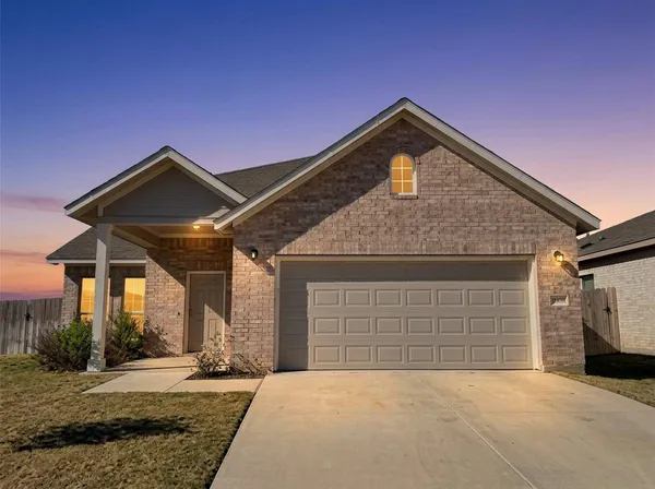 a front view of a house with a garage