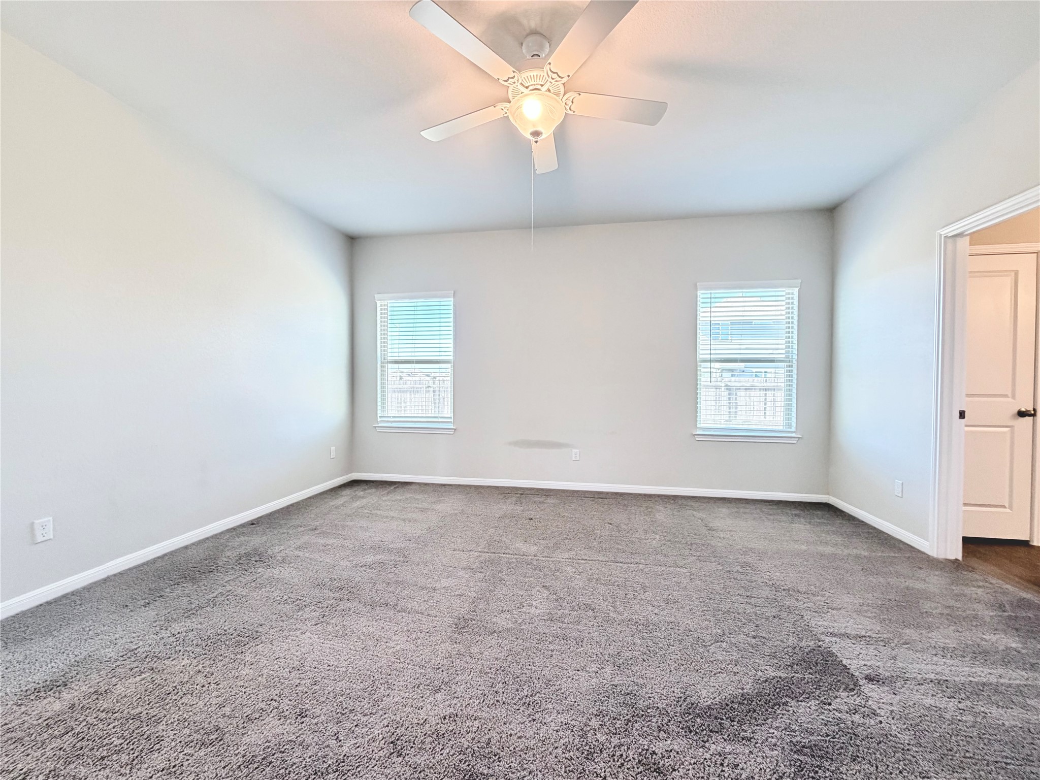 18104 Emu Lane Manor, TX 78653 - Photo 19 of 39 wooden floor in an empty room with a window