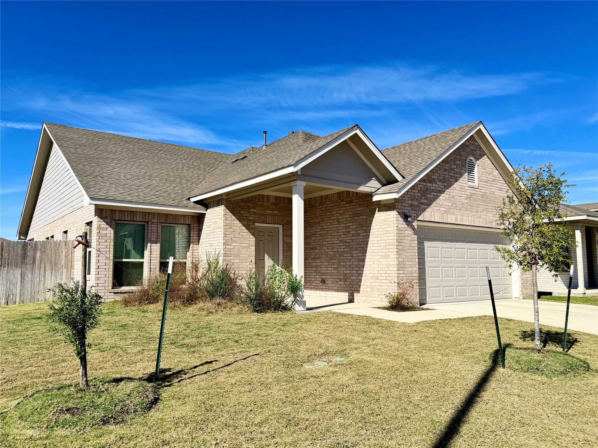 18104 Emu Lane Manor, TX 78653 - Photo 2 of 39 a front view of a house with garden