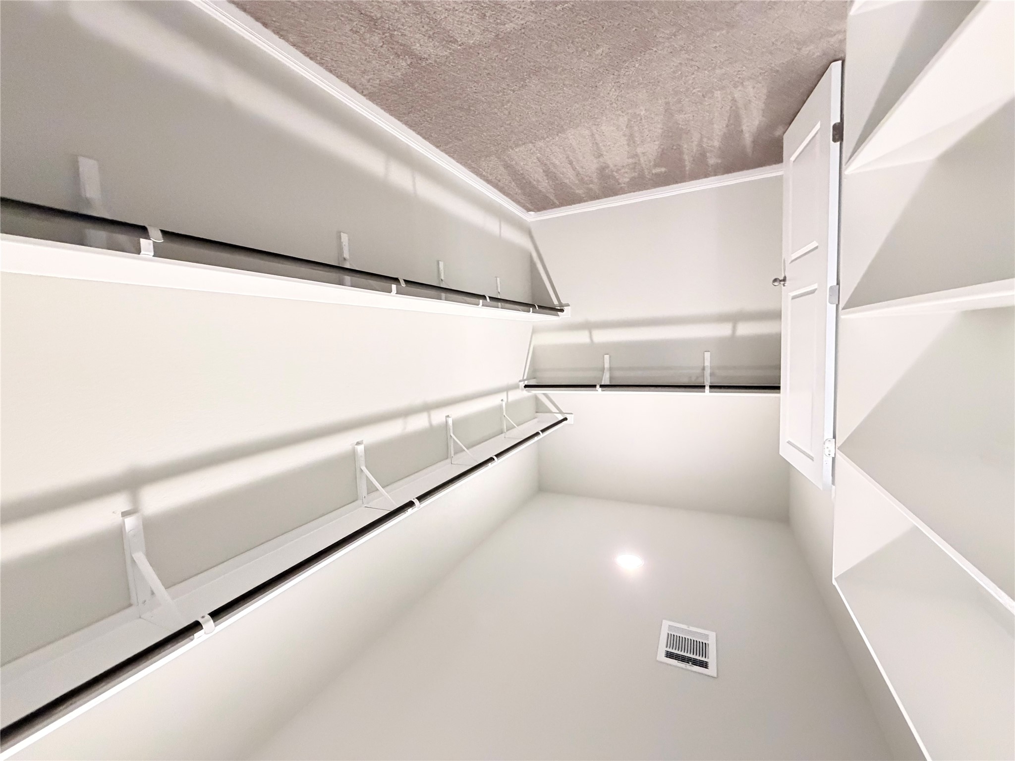 18104 Emu Lane Manor, TX 78653 - Photo 25 of 39 a view of an empty walk in closet