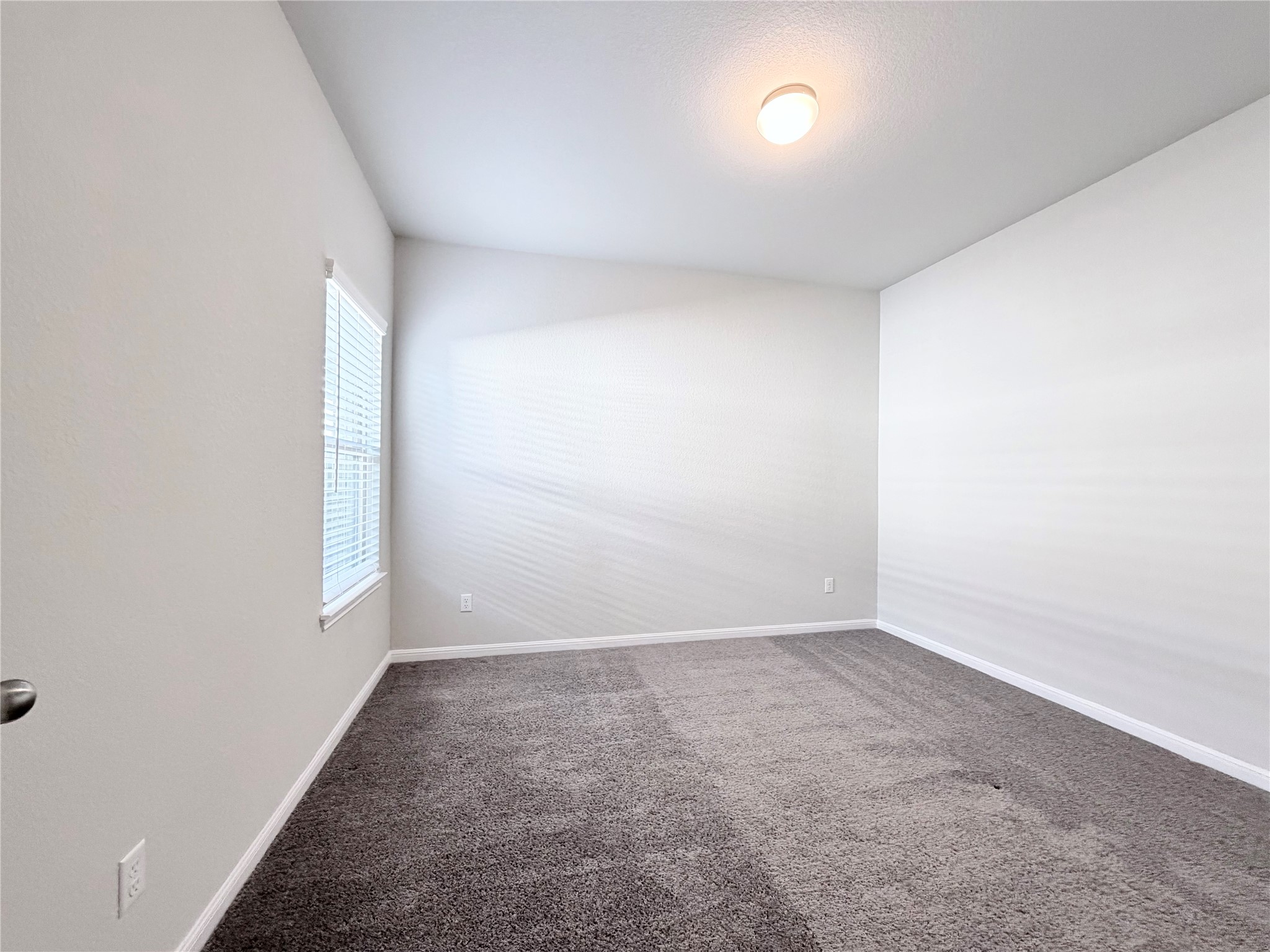 18104 Emu Lane Manor, TX 78653 - Photo 30 of 39 an empty room with a empty space and windows