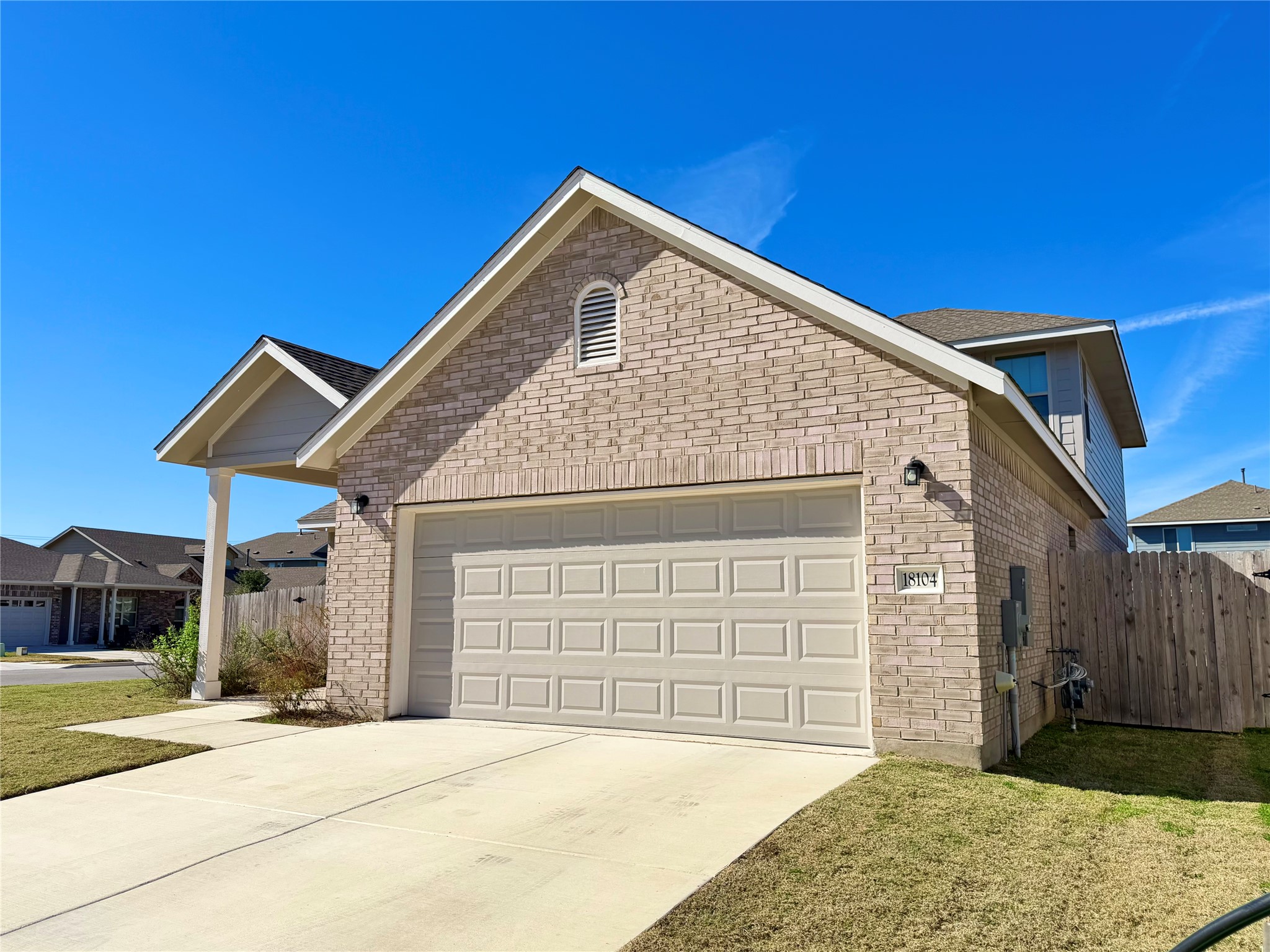 18104 Emu Lane Manor, TX 78653 - Photo 3 of 39 a front view of a house with a garage