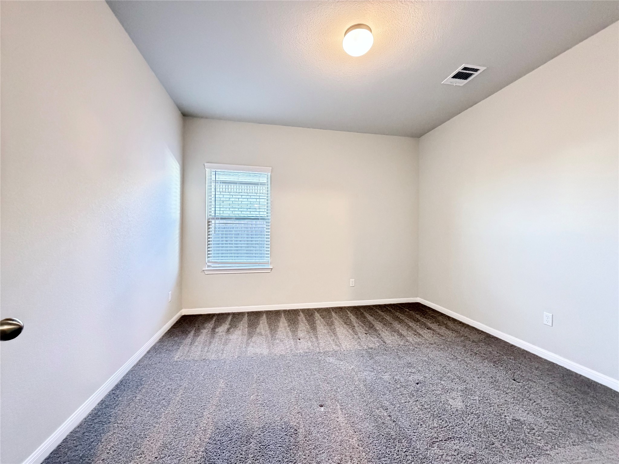 18104 Emu Lane Manor, TX 78653 - Photo 35 of 39 an empty room with a window
