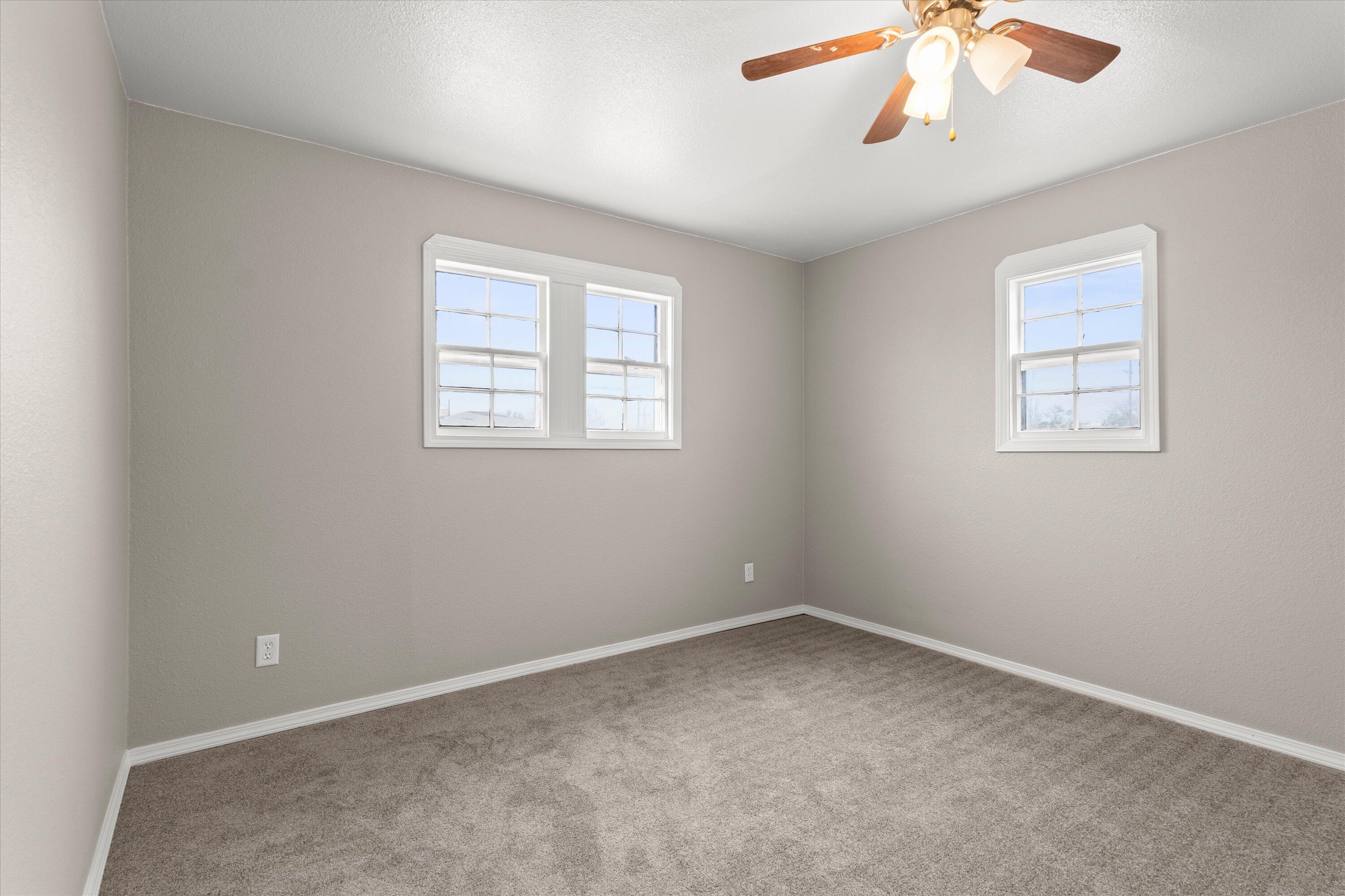 204 Ave L Levelland, TX 79336 - Photo 12 of 27 an empty room with a window