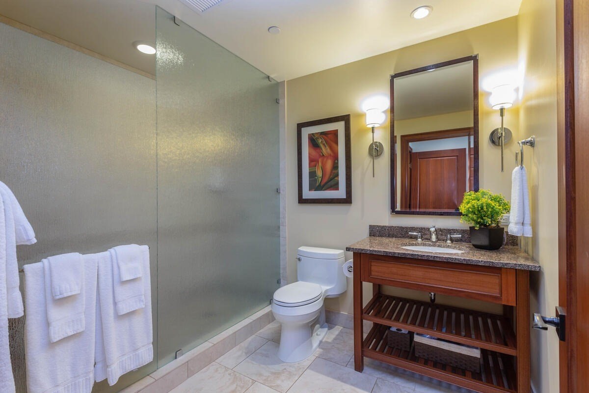 2641 Poipu Road, Unit 6401 Koloa, HI 96756 - Photo 21 of 30 a bathroom with a sink a toilet and mirror