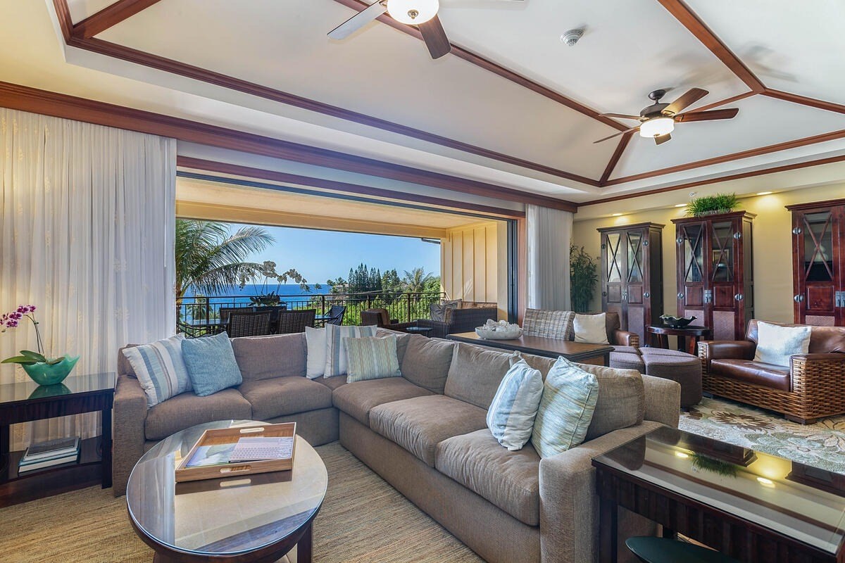 2641 Poipu Road, Unit 6401 Koloa, HI 96756 - Photo 5 of 30 a living room with furniture and a large window