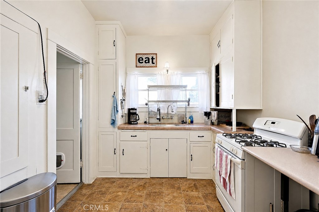 2130 Canal Street Merced, CA 95340 - Photo 14 of 45 a kitchen with a sink stove and refrigerator