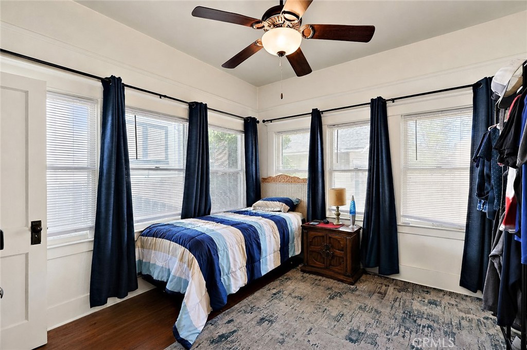 2130 Canal Street Merced, CA 95340 - Photo 19 of 45 a bedroom with a bed and a large mirror with a flat tv screen