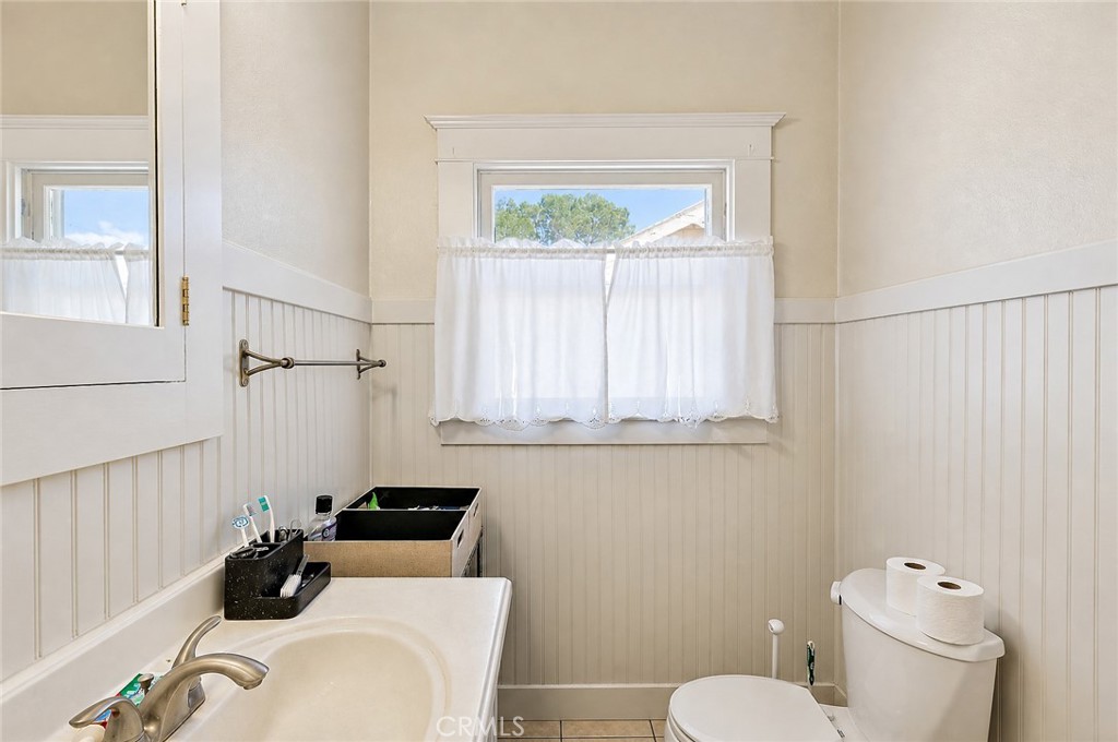 2130 Canal Street Merced, CA 95340 - Photo 24 of 45 a bathroom with a sink a toilet and a window