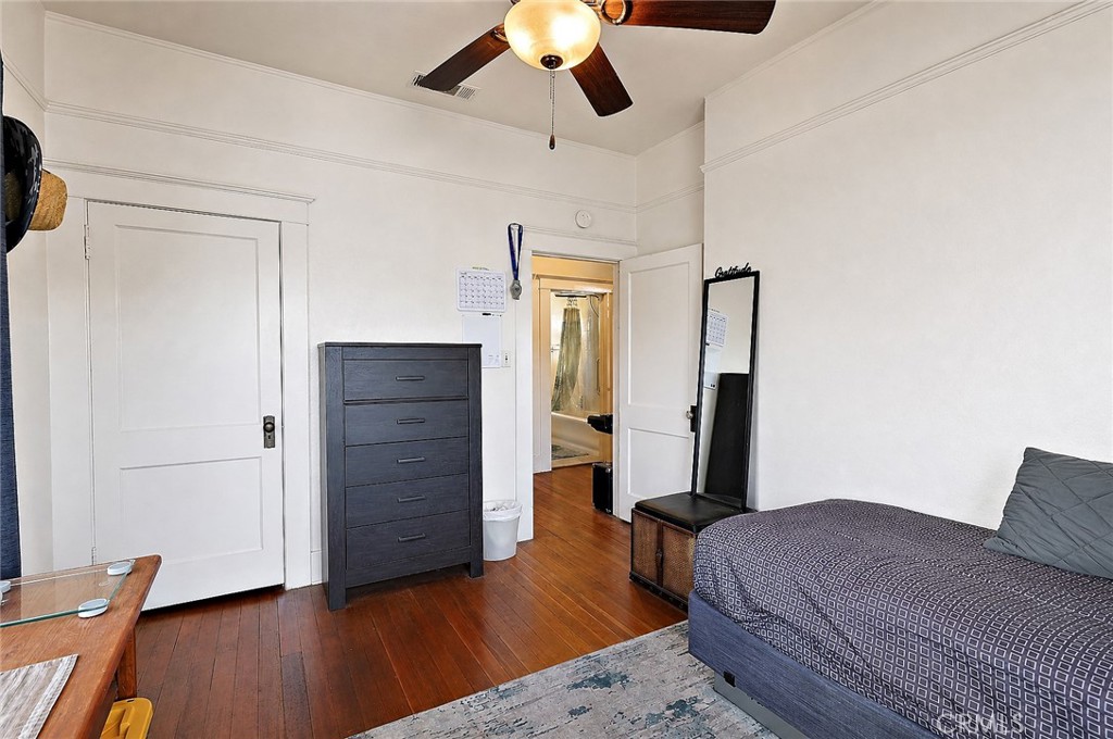 2130 Canal Street Merced, CA 95340 - Photo 27 of 45 a bedroom with a bed and wooden floor