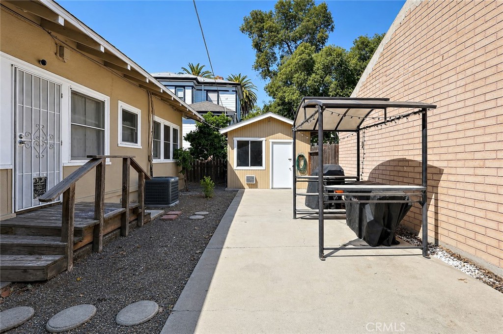 2130 Canal Street Merced, CA 95340 - Photo 30 of 45 a view of a patio with table and chairs with wooden floor and fence
