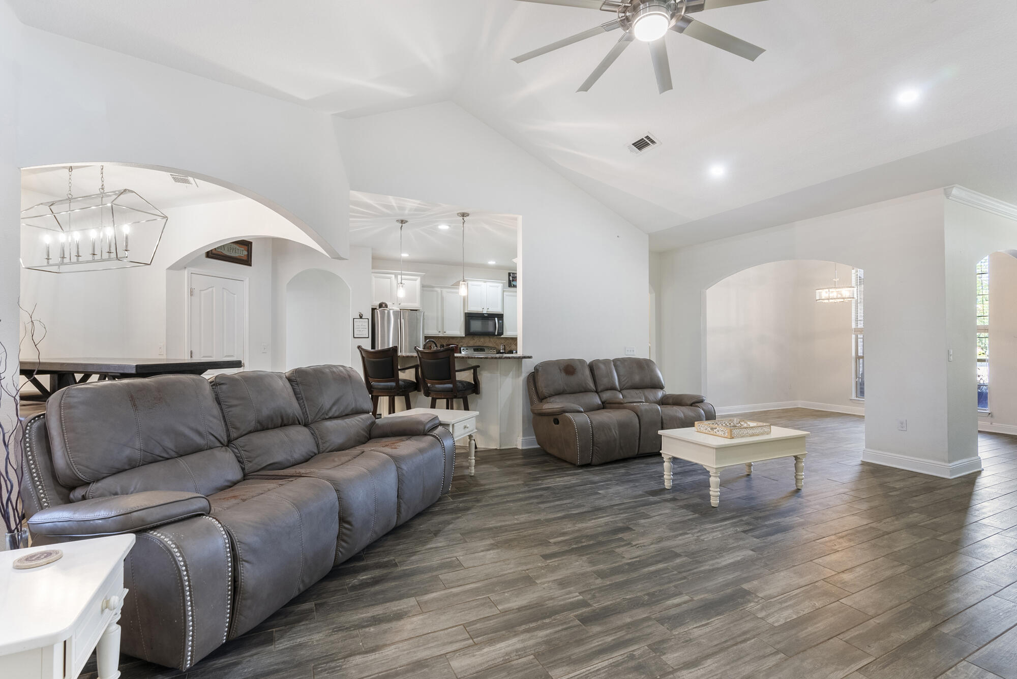 517 Pheasant Trail Crestview, FL 32536 - Photo 11 of 64 a living room with furniture and a wooden floor