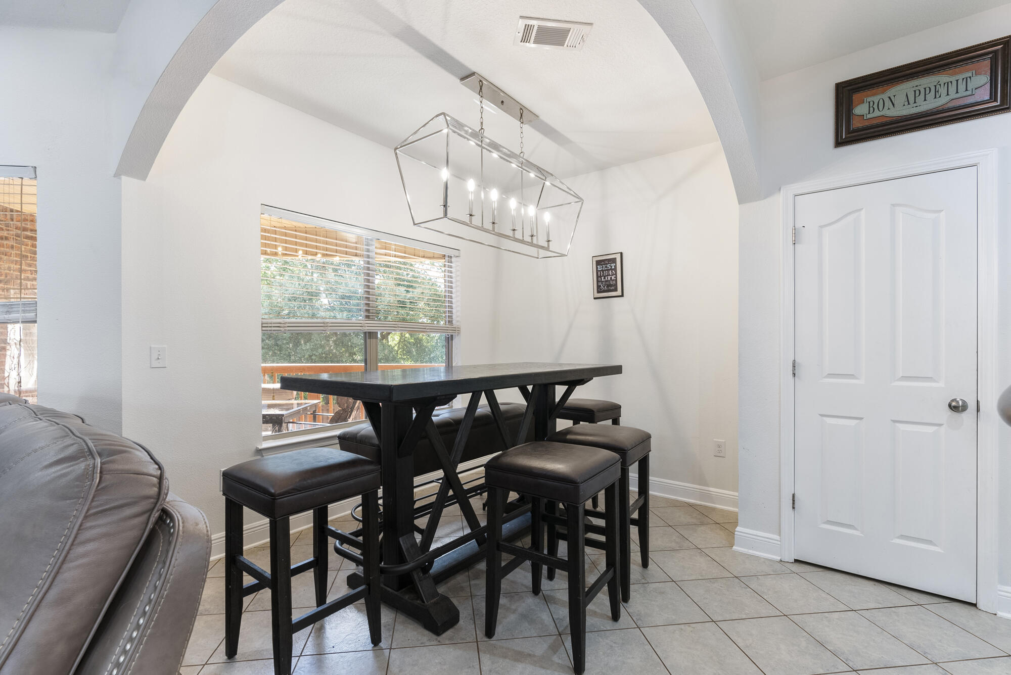 517 Pheasant Trail Crestview, FL 32536 - Photo 12 of 64 a view of a dining room with furniture and chandelier