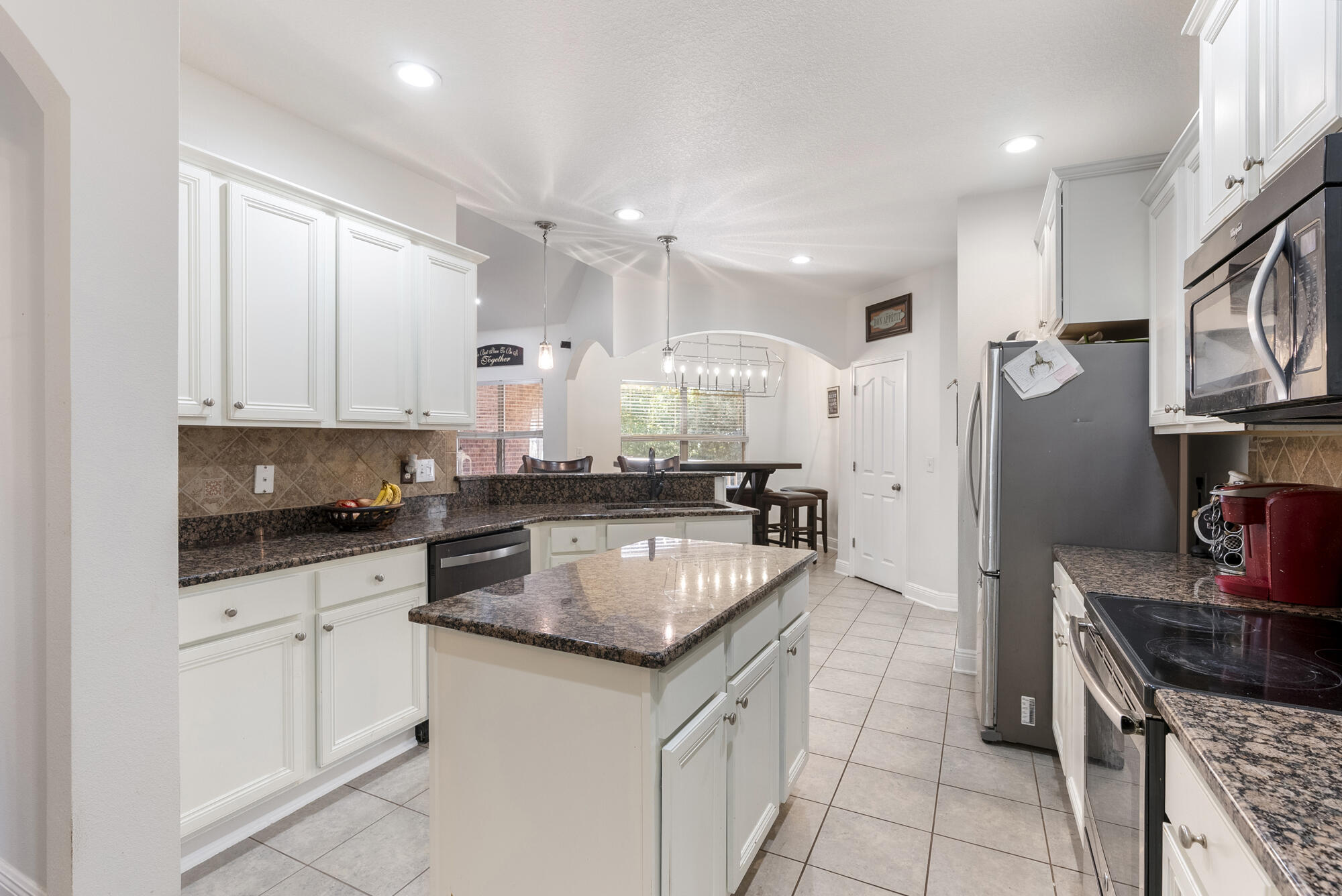 517 Pheasant Trail Crestview, FL 32536 - Photo 15 of 64 a kitchen with stainless steel appliances granite countertop a sink stove and cabinets