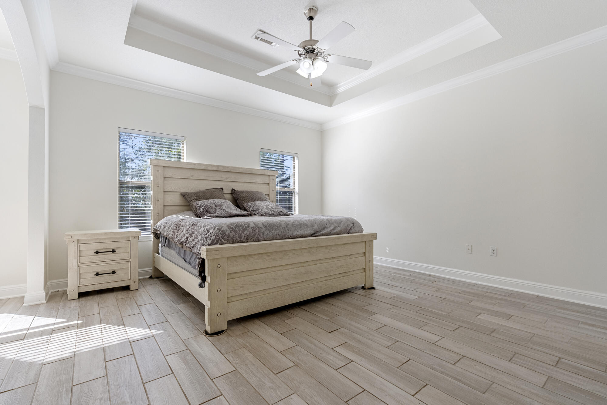 517 Pheasant Trail Crestview, FL 32536 - Photo 18 of 64 a bedroom with a bed and a ceiling fan