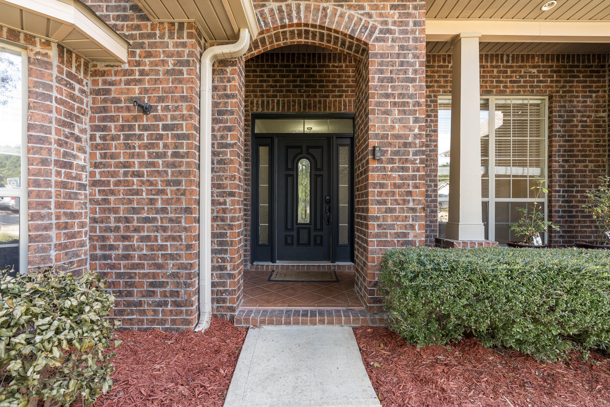 517 Pheasant Trail Crestview, FL 32536 - Photo 2 of 64 a front view of a house with a door