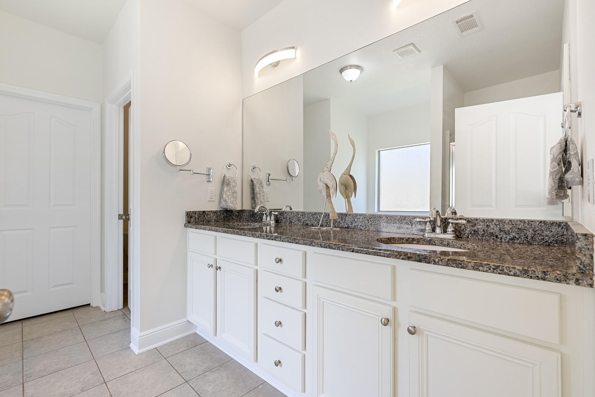 517 Pheasant Trail Crestview, FL 32536 - Photo 22 of 64 a bathroom with a granite countertop sink and a mirror