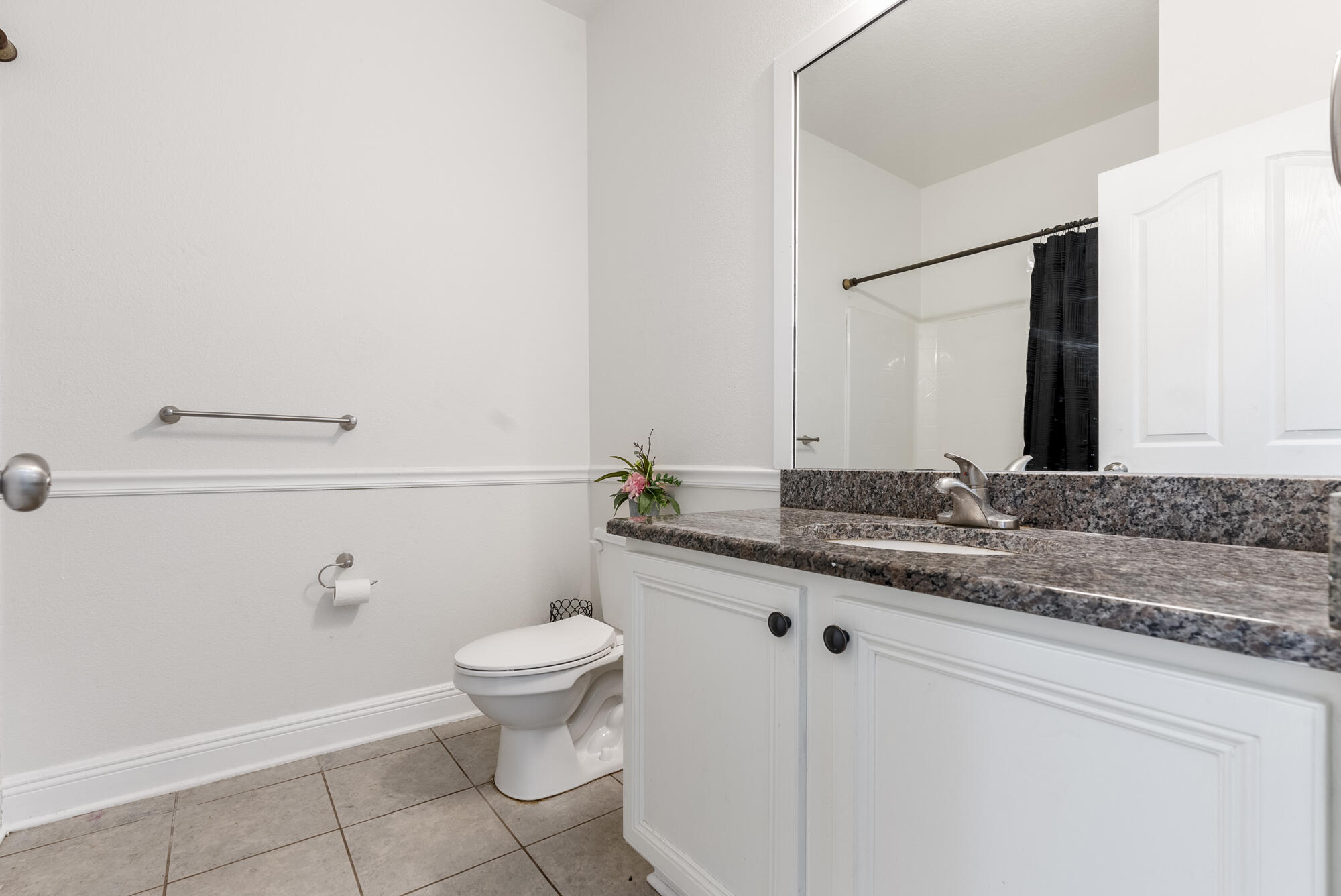 517 Pheasant Trail Crestview, FL 32536 - Photo 27 of 64 a bathroom with a granite countertop sink a toilet and a mirror