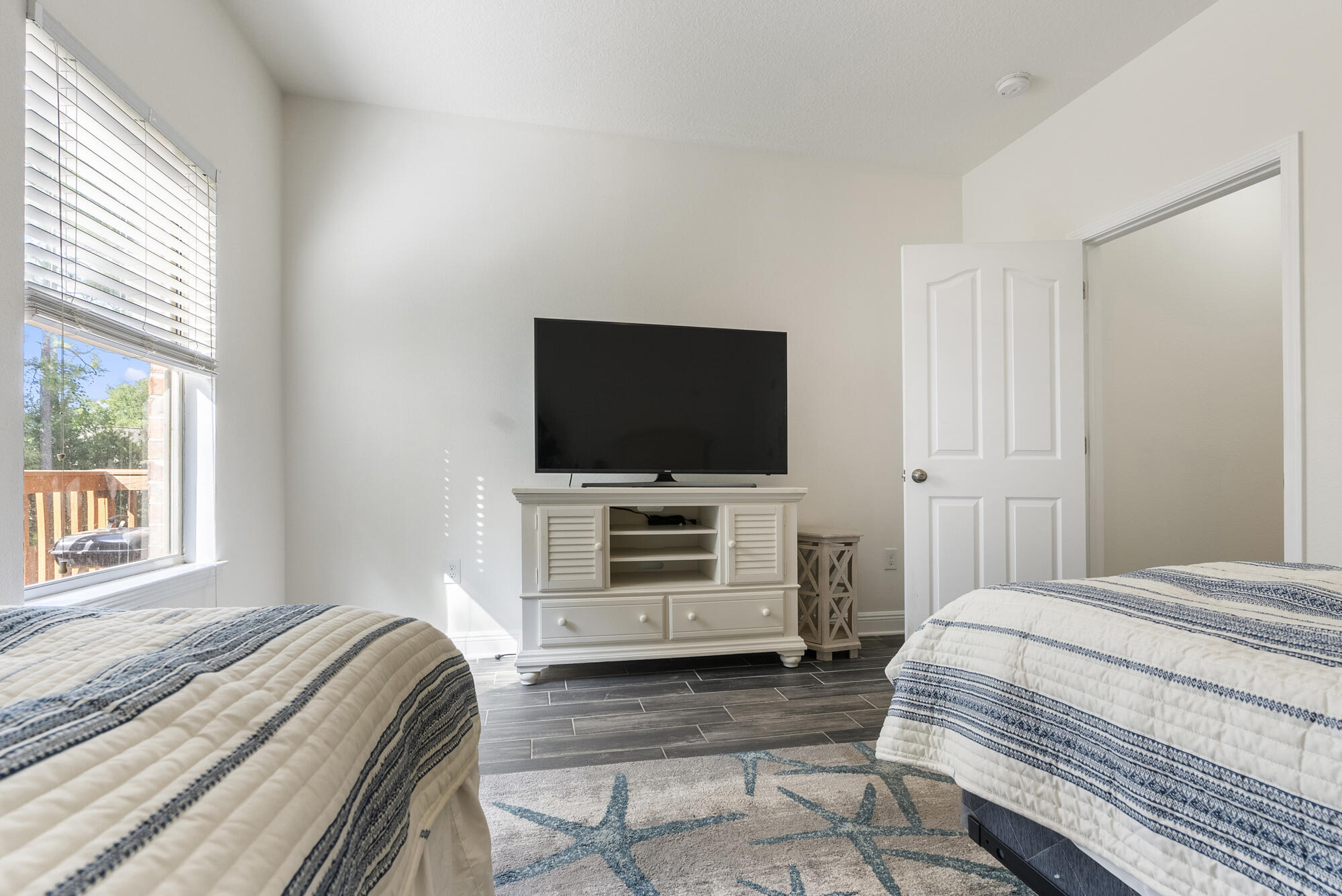 517 Pheasant Trail Crestview, FL 32536 - Photo 29 of 64 a bedroom with a bed and a flat screen tv