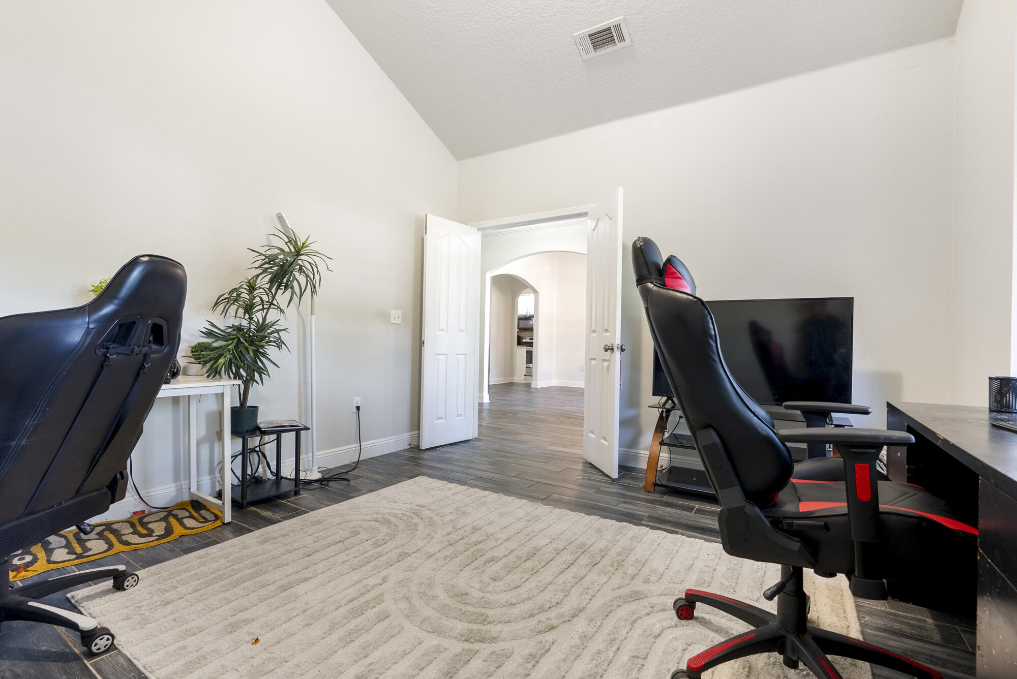 517 Pheasant Trail Crestview, FL 32536 - Photo 32 of 64 a view of a workspace with furniture and a potted plant