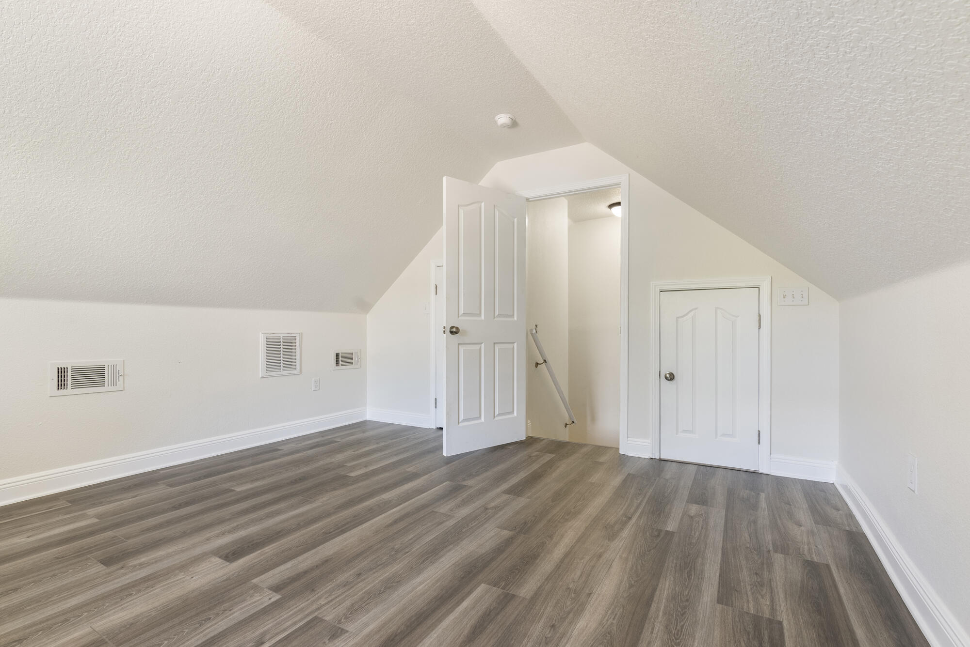517 Pheasant Trail Crestview, FL 32536 - Photo 34 of 64 a view of an empty room with wooden floor