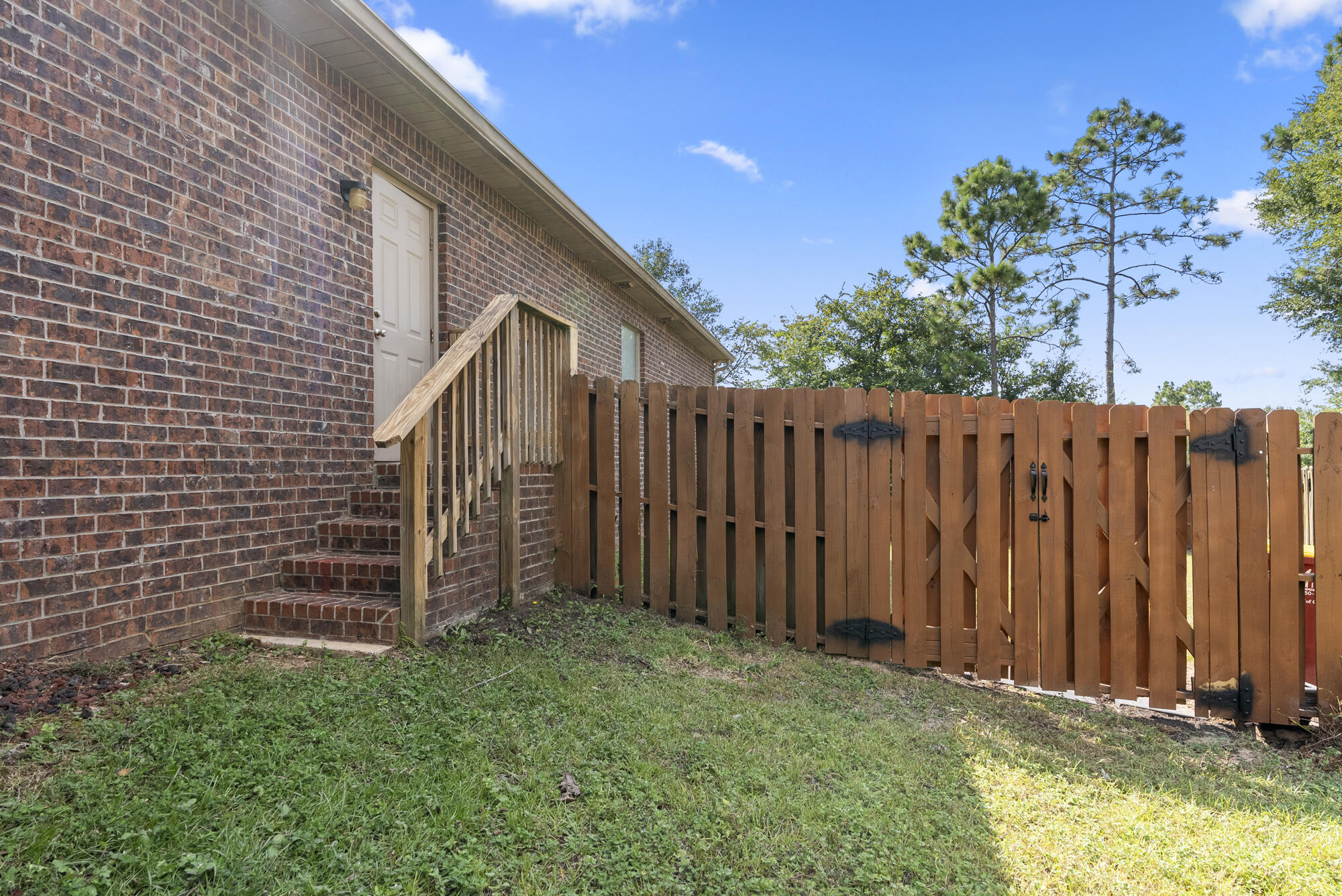 517 Pheasant Trail Crestview, FL 32536 - Photo 38 of 64 a view of a backyard with wooden fence