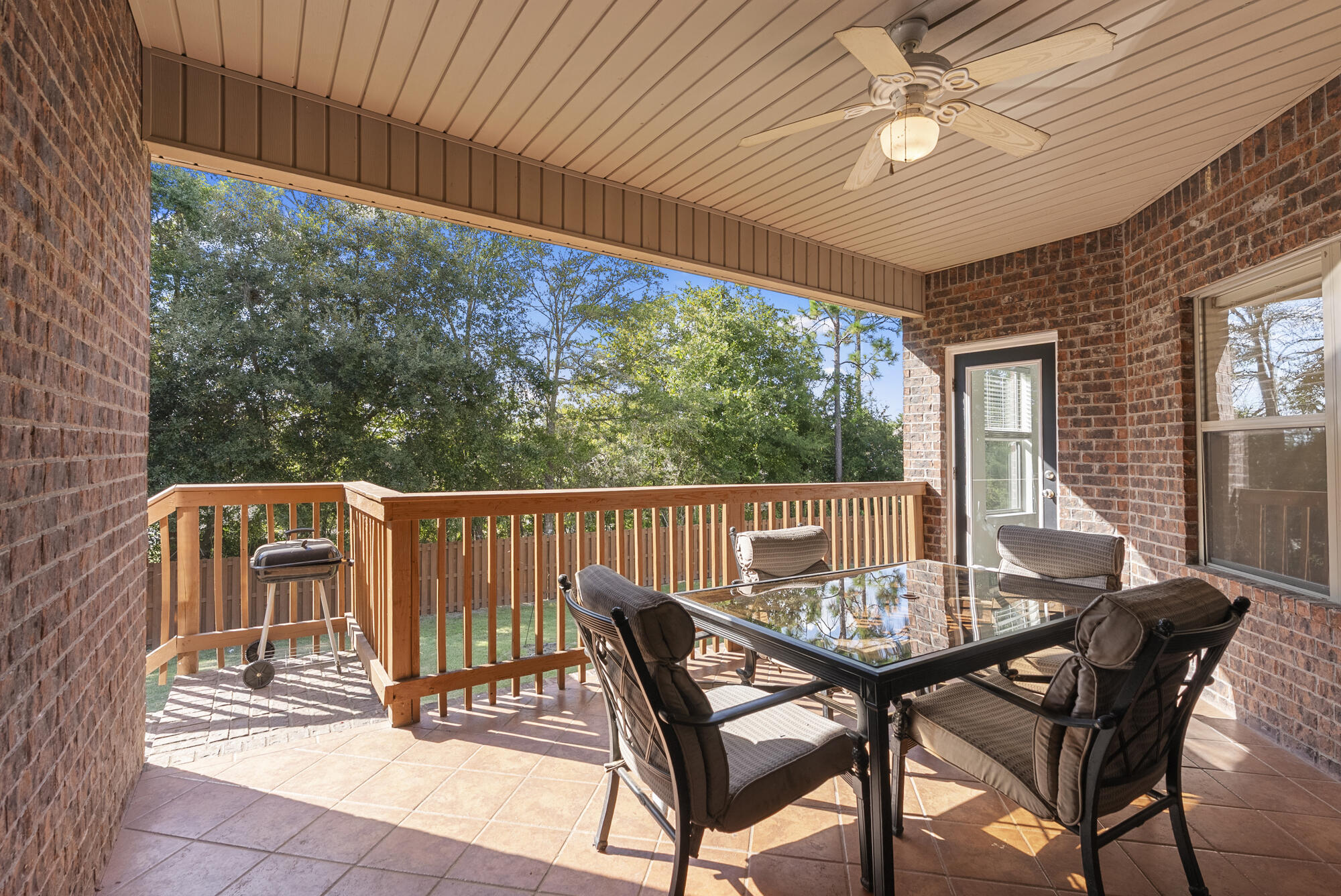 517 Pheasant Trail Crestview, FL 32536 - Photo 41 of 64 a view of a patio with a table chairs and backyard