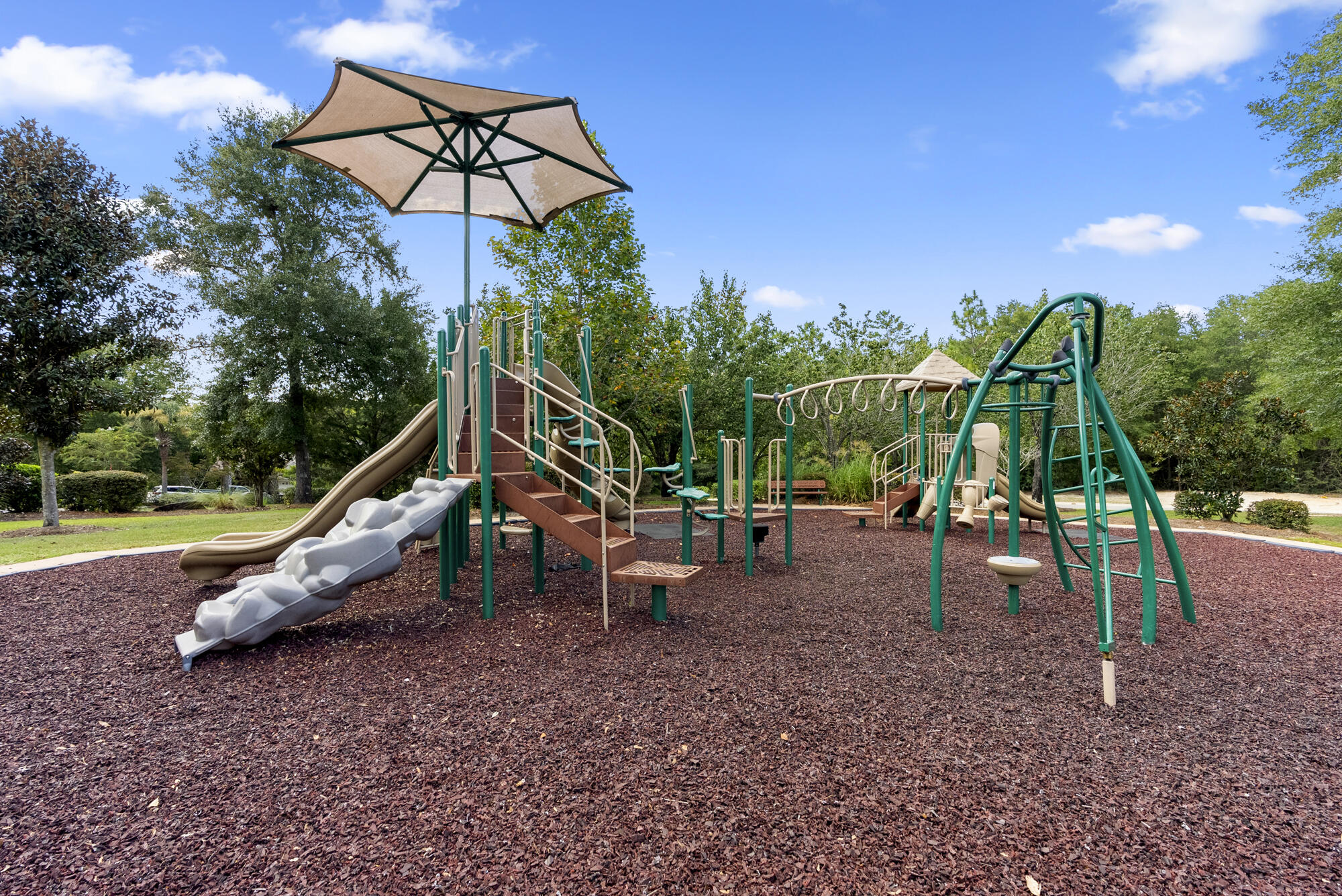 517 Pheasant Trail Crestview, FL 32536 - Photo 49 of 64 a view of a park with swings
