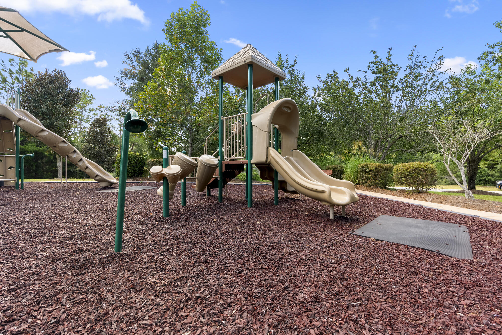 517 Pheasant Trail Crestview, FL 32536 - Photo 51 of 64 a childrens park with lots of swings and slides