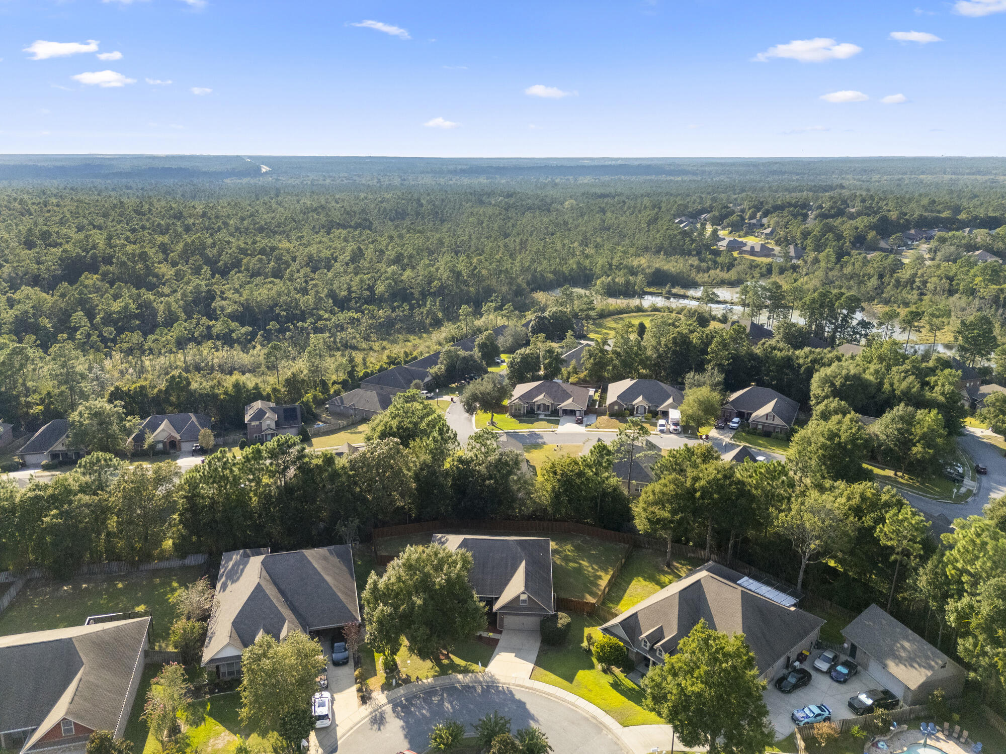 517 Pheasant Trail Crestview, FL 32536 - Photo 54 of 64 an aerial view of a house with a yard and lake view